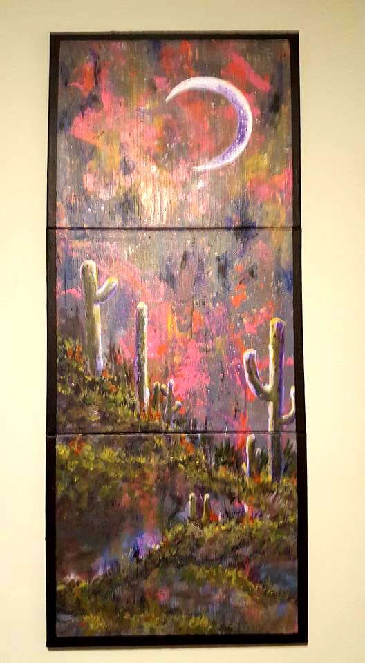 Desert landscape with cacti under crescent moon