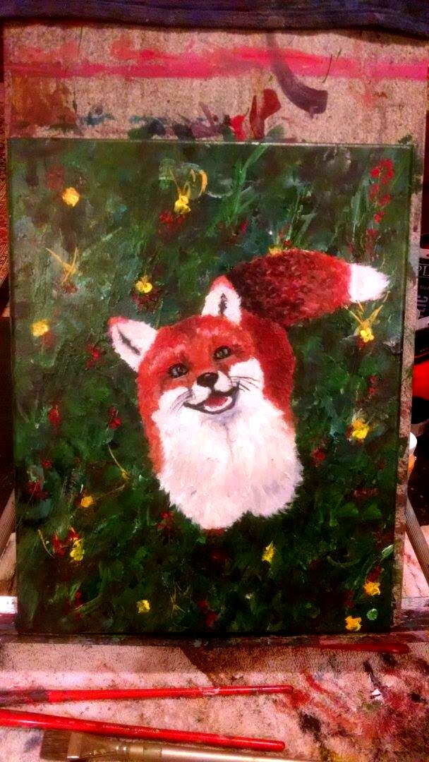 Happy fox in wildflowers