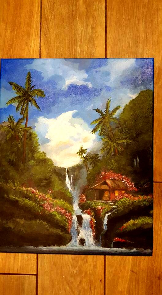 Tropical waterfall with palm trees and cottage