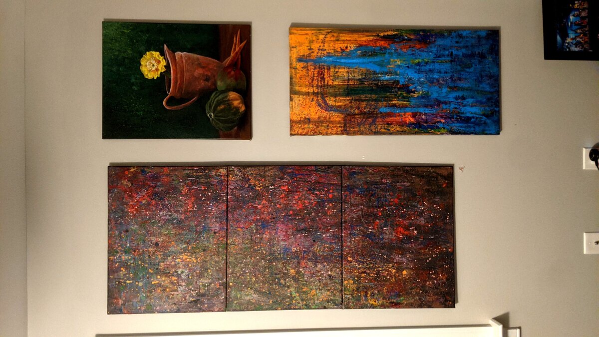 Gallery wall with multiple paintings